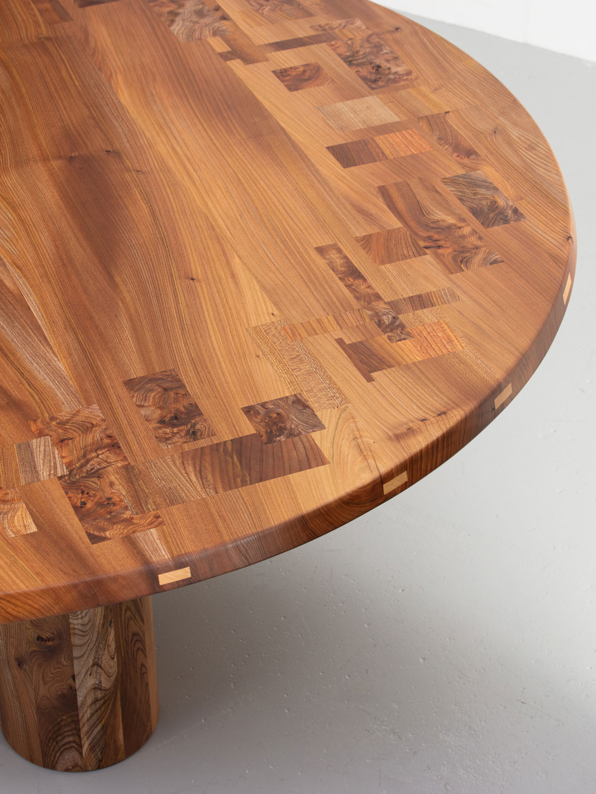 Large Pier round table made with a pattern inlayed table top of Scottish Elm and staved Scottish Elm legs